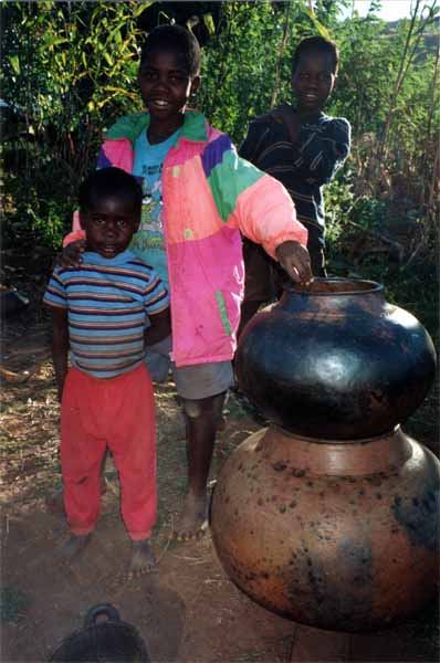 Photo of boys selling pots